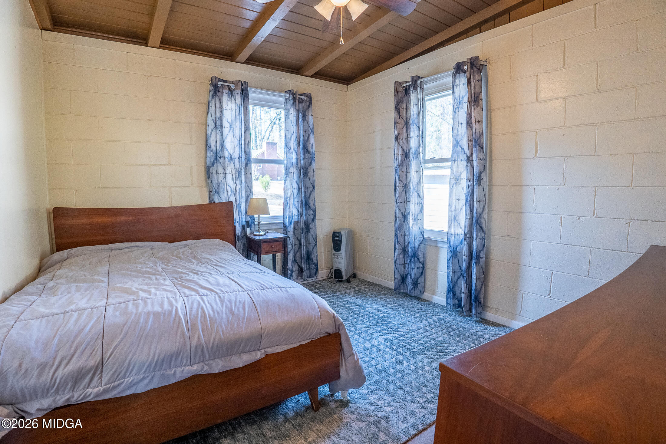199 Cherokee Drive Jackson, GA 30233 - Photo 12 of 25 a bedroom with a bed and a dresser