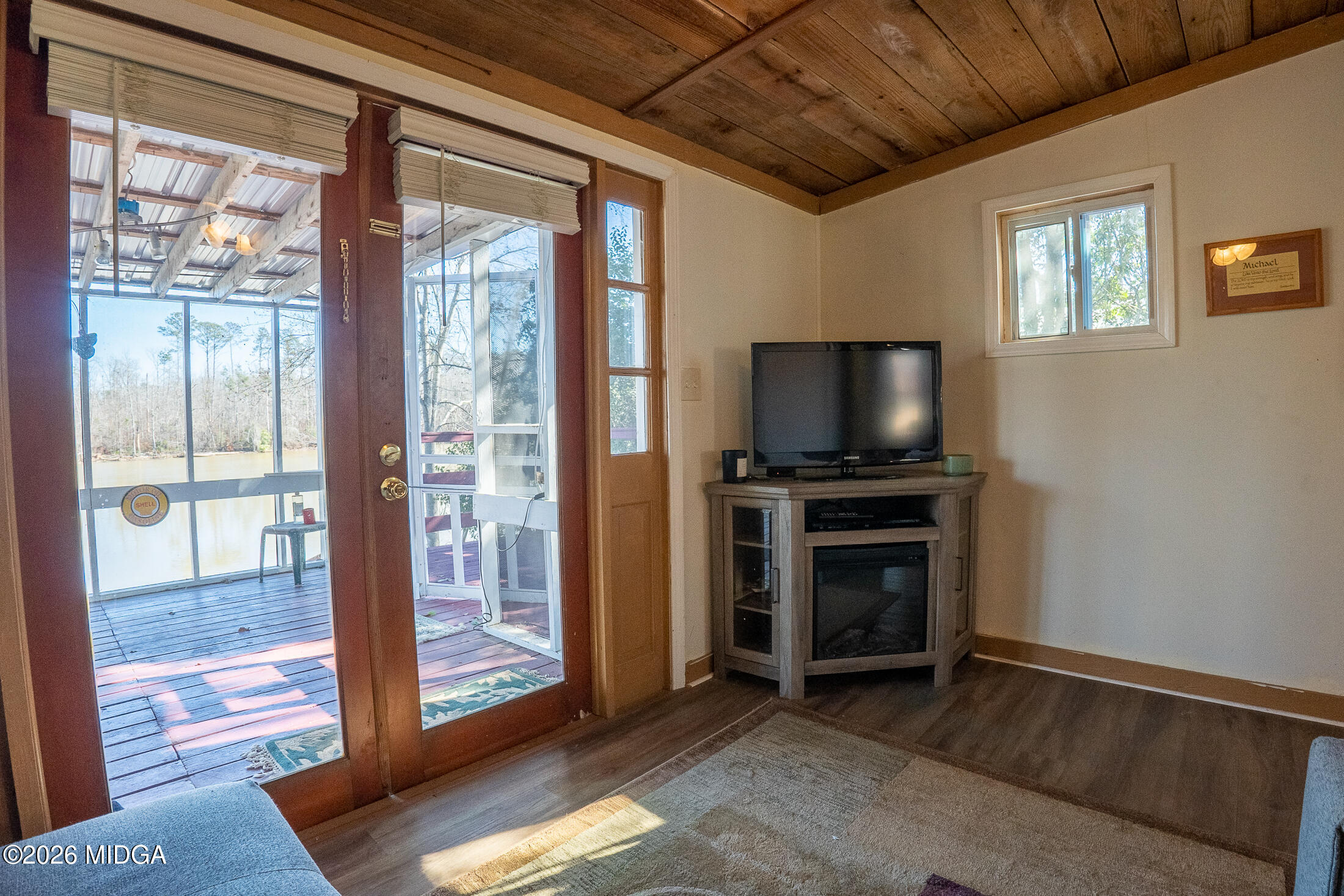 199 Cherokee Drive Jackson, GA 30233 - Photo 16 of 25 a living room with furniture and a flat screen tv