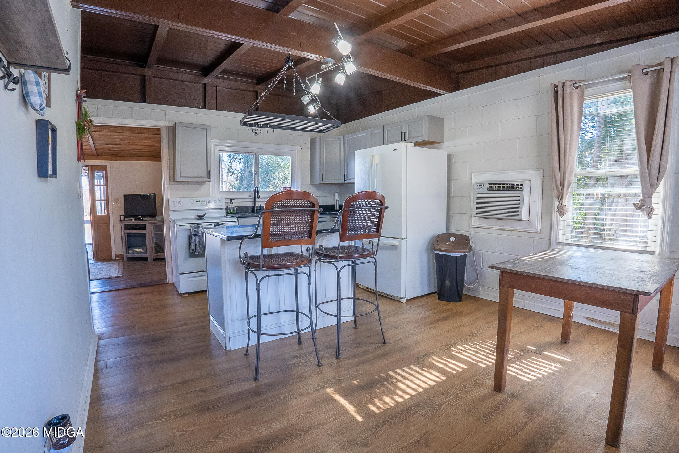 199 Cherokee Drive Jackson, GA 30233 - Photo 5 of 25 a living room with furniture a fireplace and a table