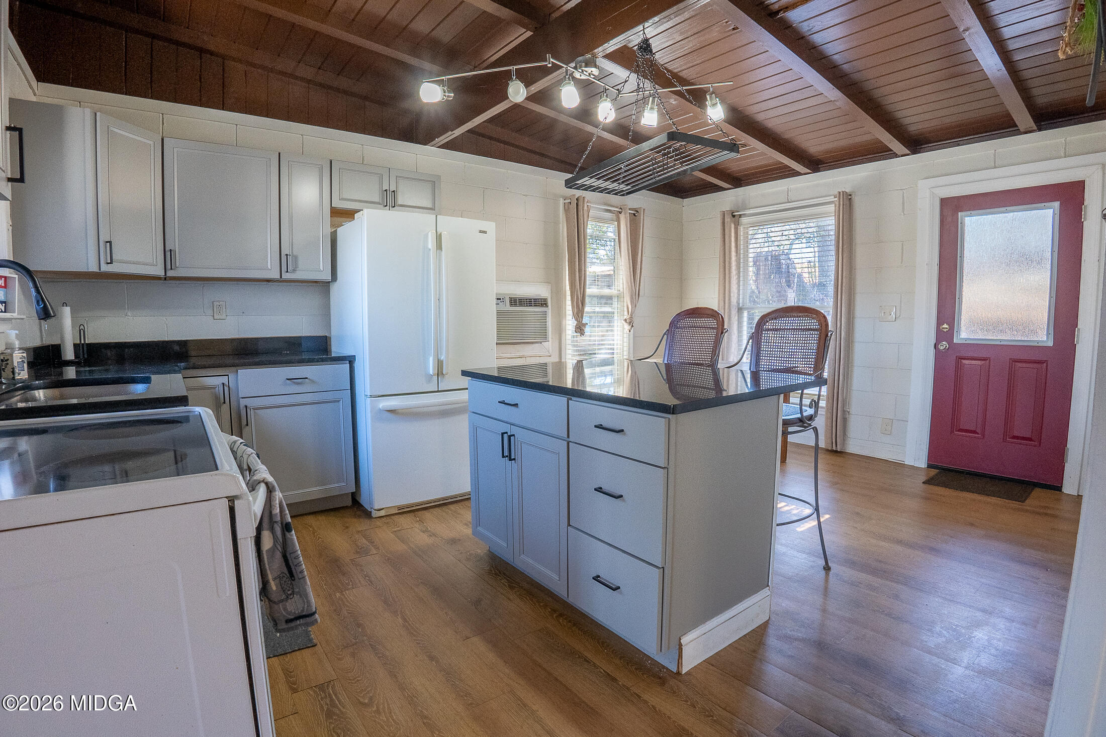 199 Cherokee Drive Jackson, GA 30233 - Photo 6 of 25 a kitchen with sink a stove and cabinets
