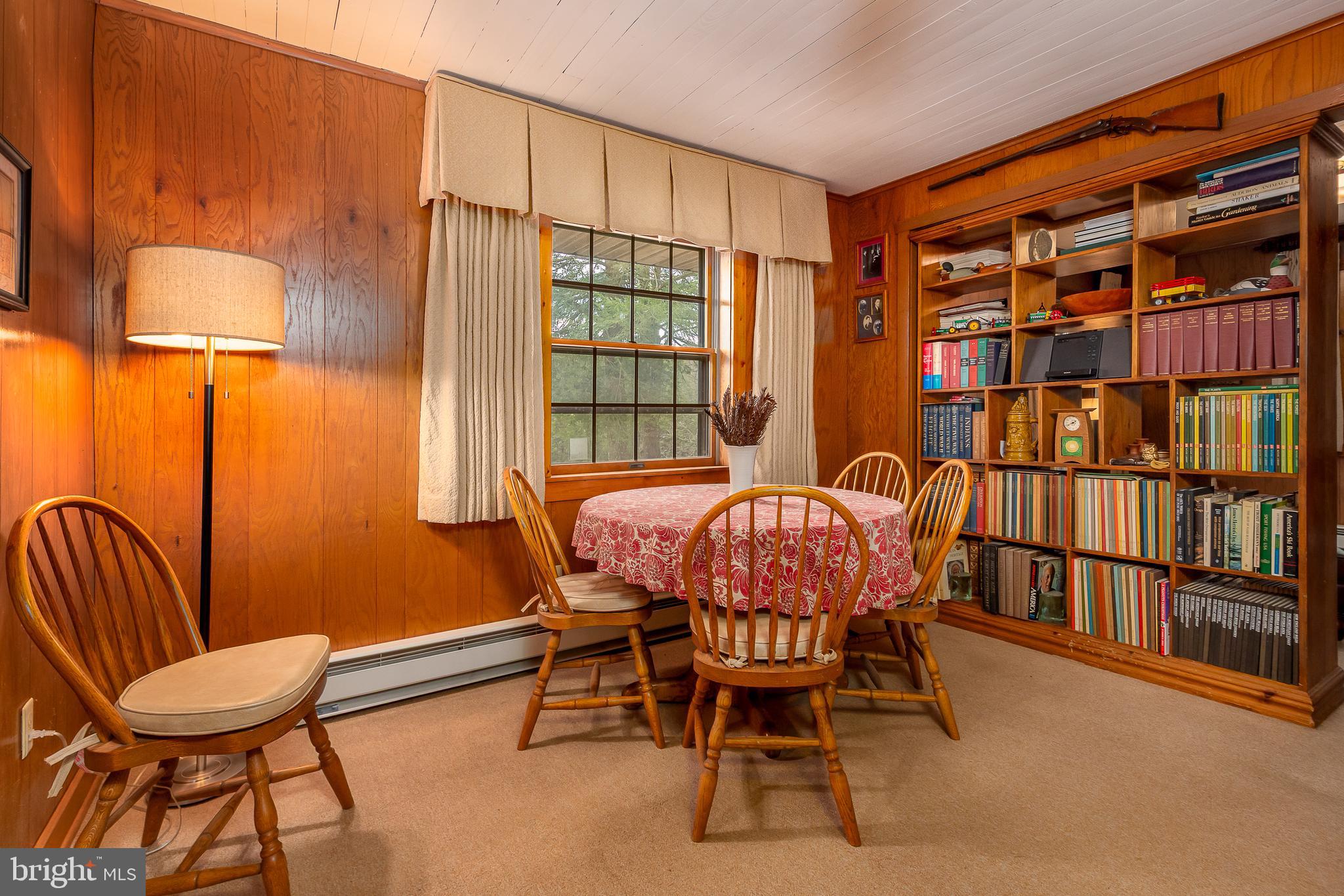 1157 Lakeford Road Terra Alta, WV 26764 - Photo 19 of 37 a view of a dining room with furniture and a window