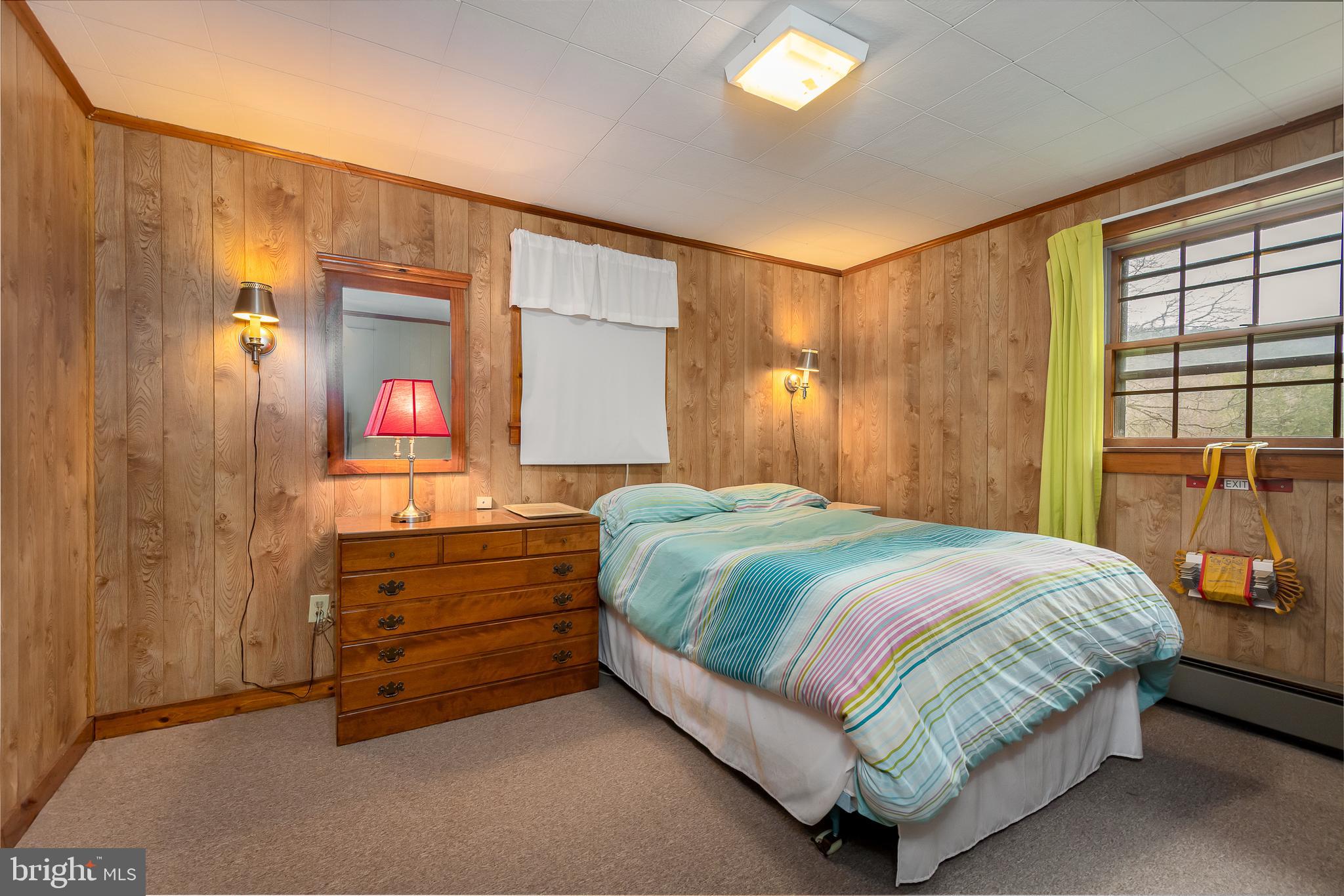 1157 Lakeford Road Terra Alta, WV 26764 - Photo 30 of 37 a bedroom with a bed and a dresser