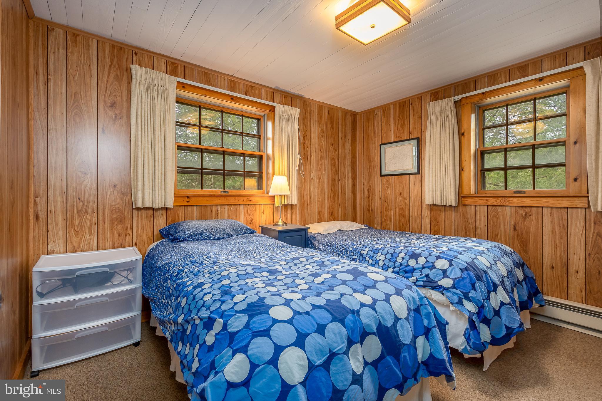 1157 Lakeford Road Terra Alta, WV 26764 - Photo 32 of 37 a bedroom with a bed and a window