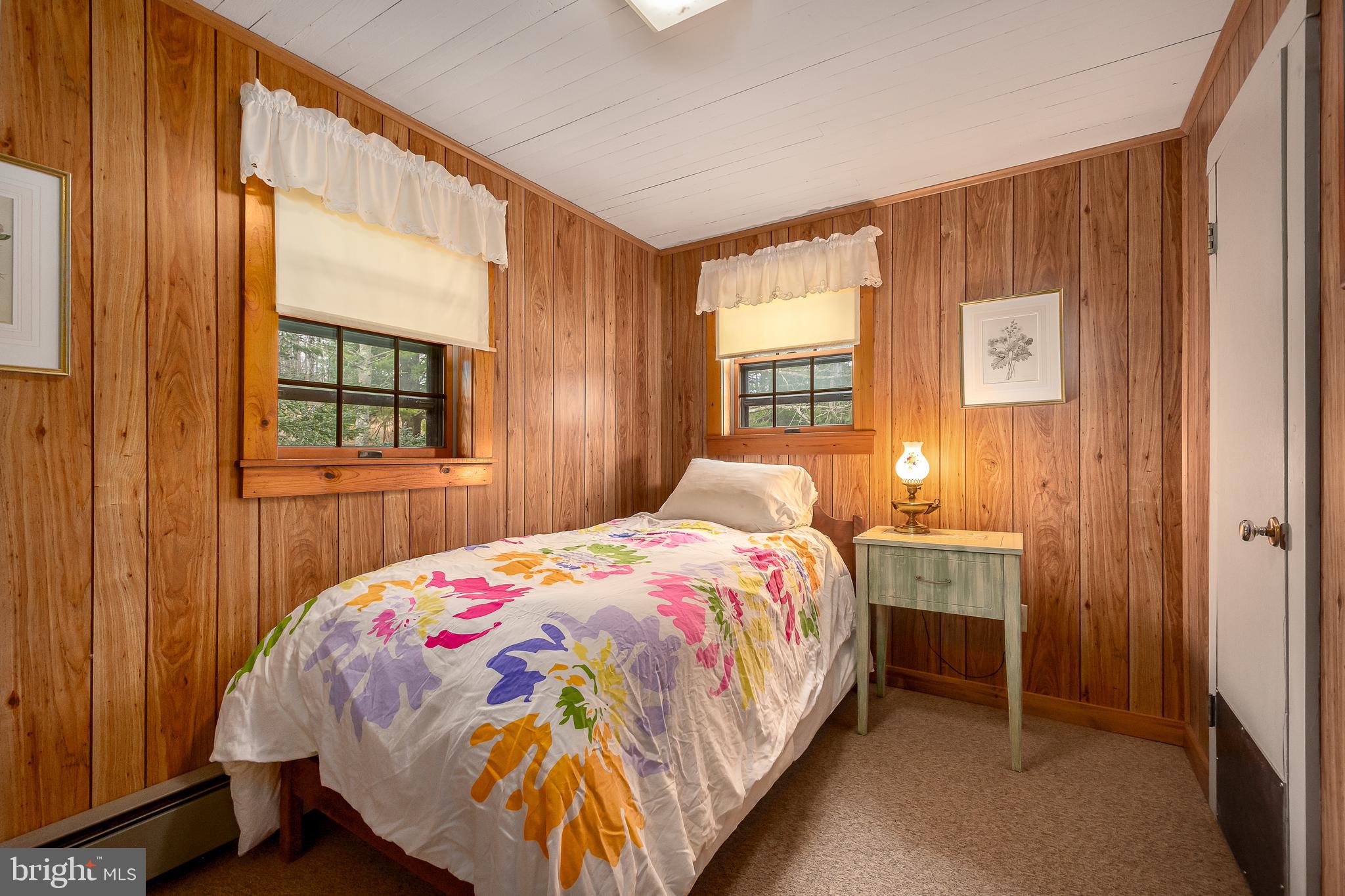 1157 Lakeford Road Terra Alta, WV 26764 - Photo 34 of 37 a bedroom with a bed and a window