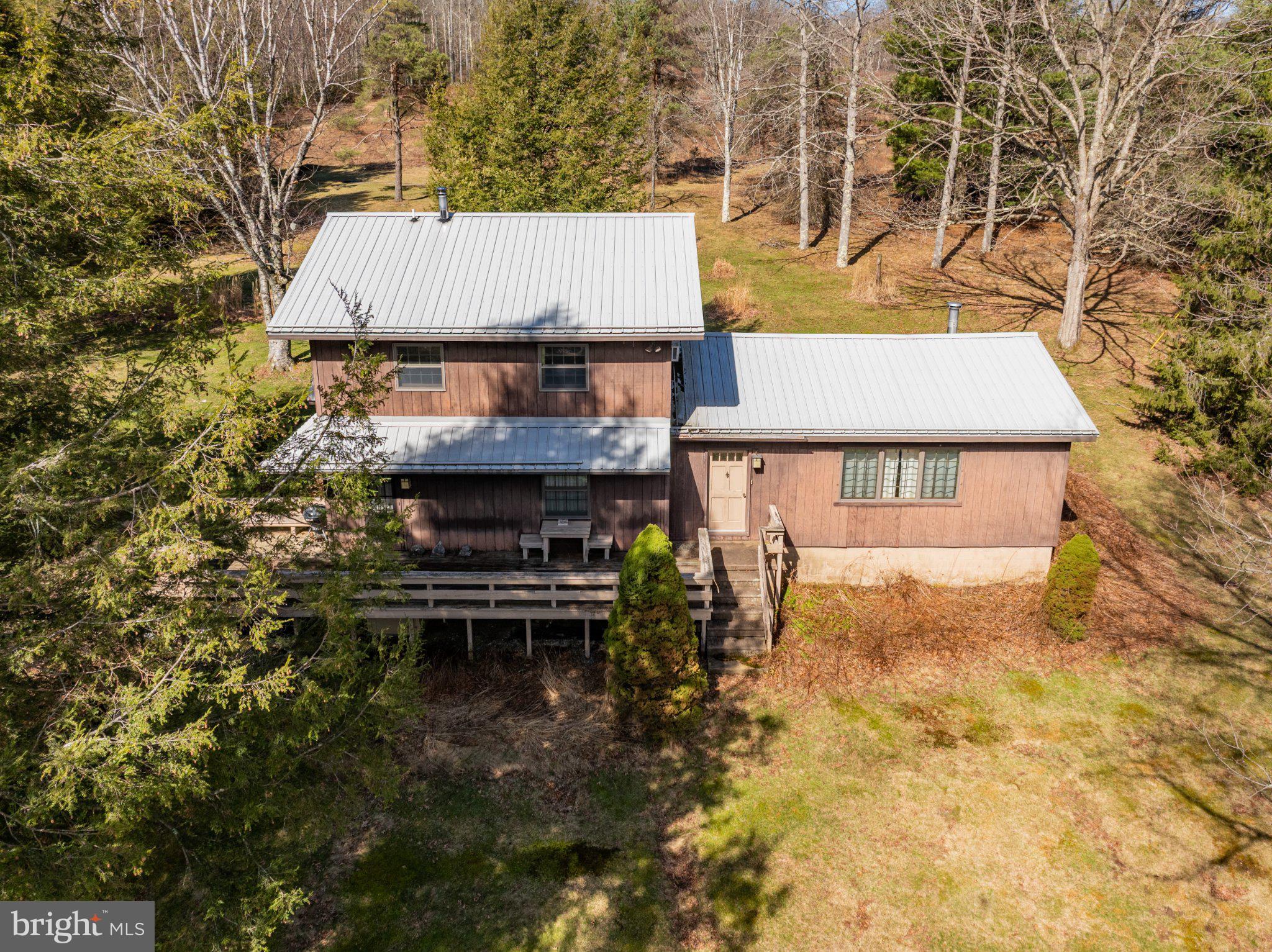 1157 Lakeford Road Terra Alta, WV 26764 - Photo 9 of 33 Charming home nestled in nature's embrace.