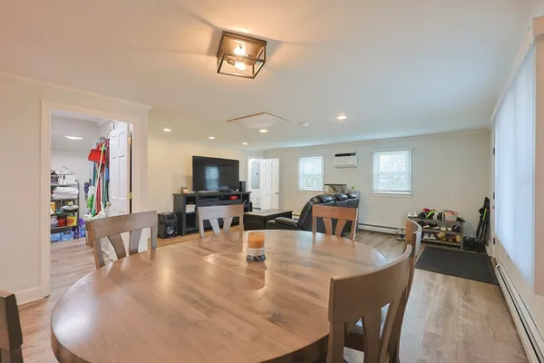 a dining room with furniture and chandelier