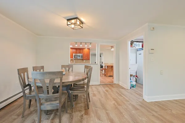 a view of a dining room with furniture and wooden floor