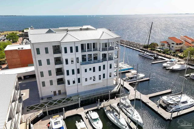 a roof deck with table and chairs