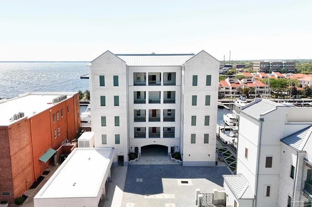 a front view of a building with a lot of windows