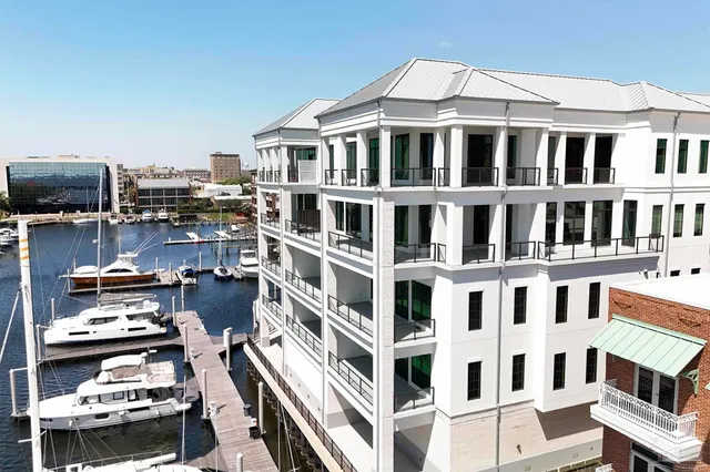 a front view of a building with many windows