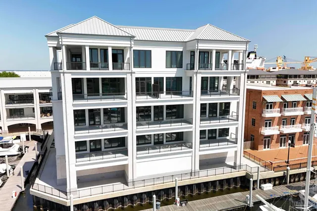 a front view of a building with a lot of windows