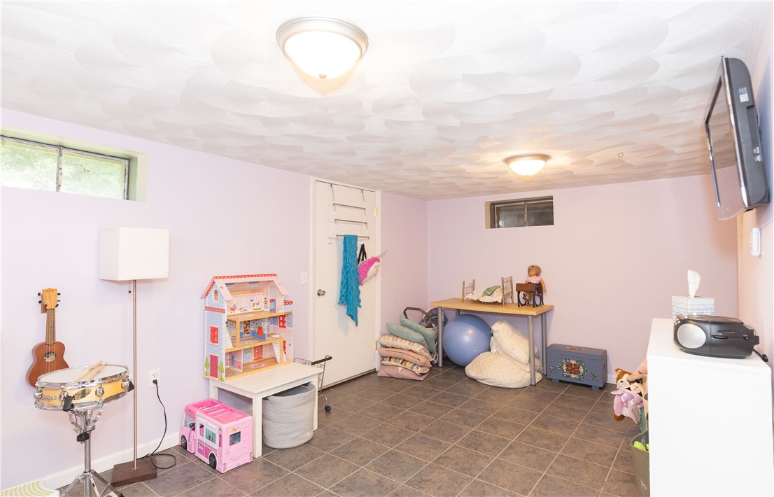 91 Plains Road South Kingstown, RI 02892 - Photo 16 of 23 Finished area in basement with bulkhead and interior access