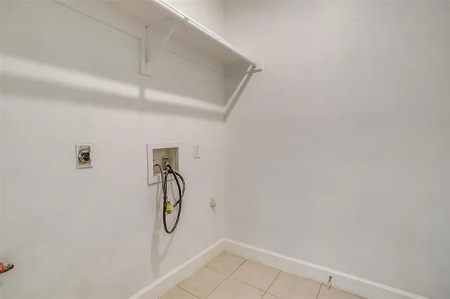 a view of a kitchen with a sink and a fireplace
