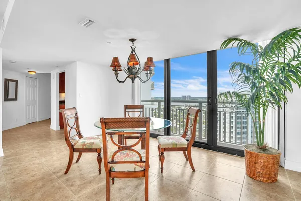 a view of a dining room with furniture window and outside view