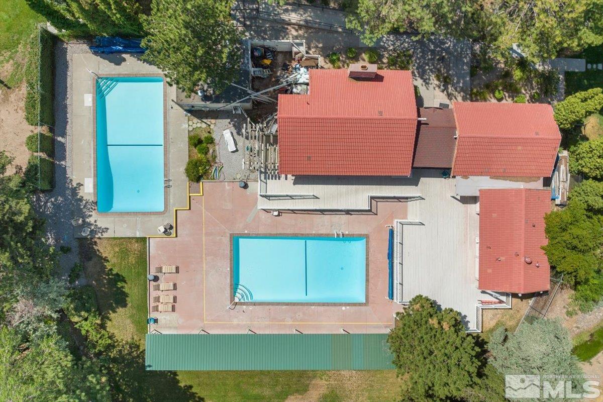 1245 Laredo Court Reno, NV 89503 - Photo 33 of 33 an aerial view of a house with a yard wooden table and chairs