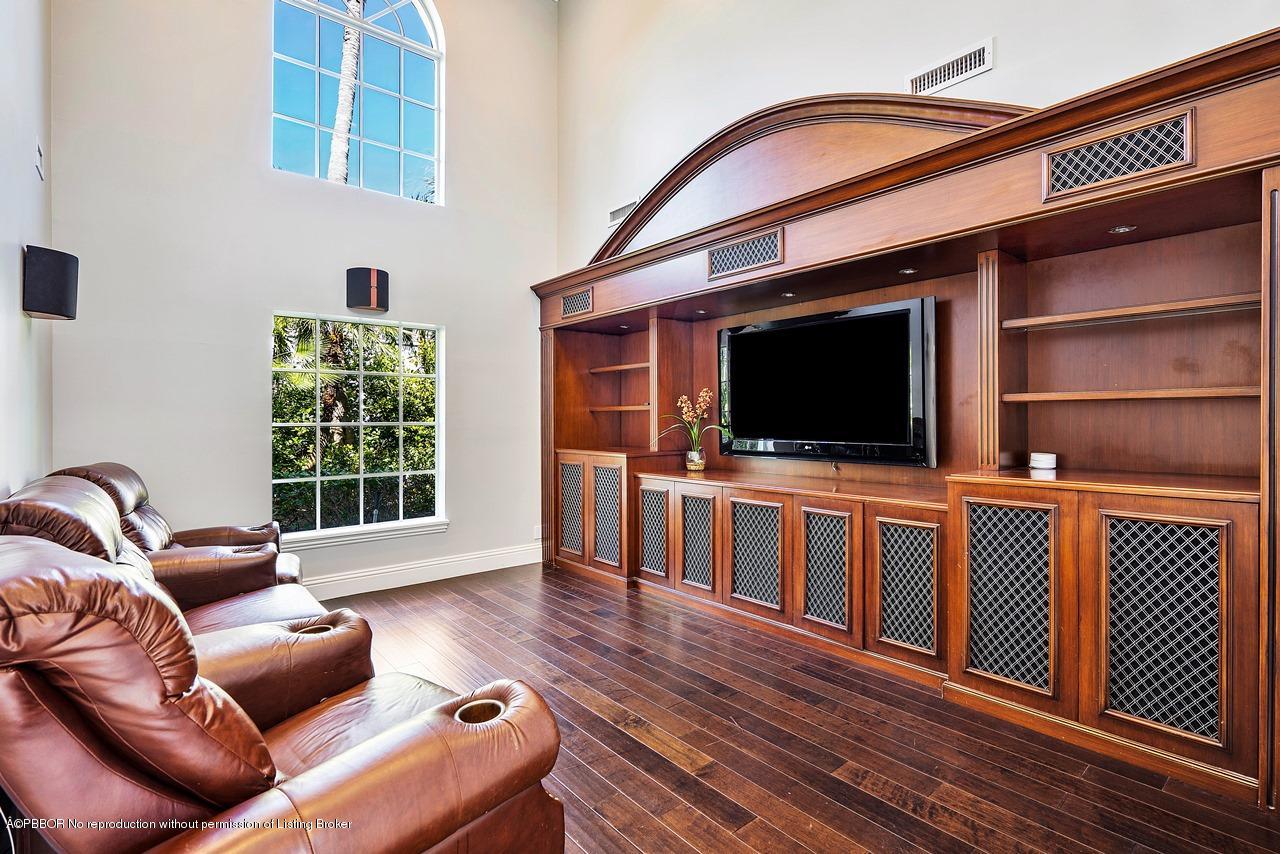 57 River Drive Ocean Ridge, FL 33435 - Photo 11 of 43 a living room with furniture and a flat screen tv