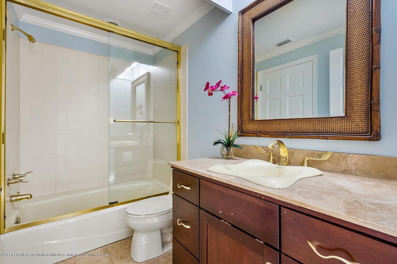 57 River Drive Ocean Ridge, FL 33435 - Photo 12 of 43 a bathroom with a granite countertop sink toilet and shower