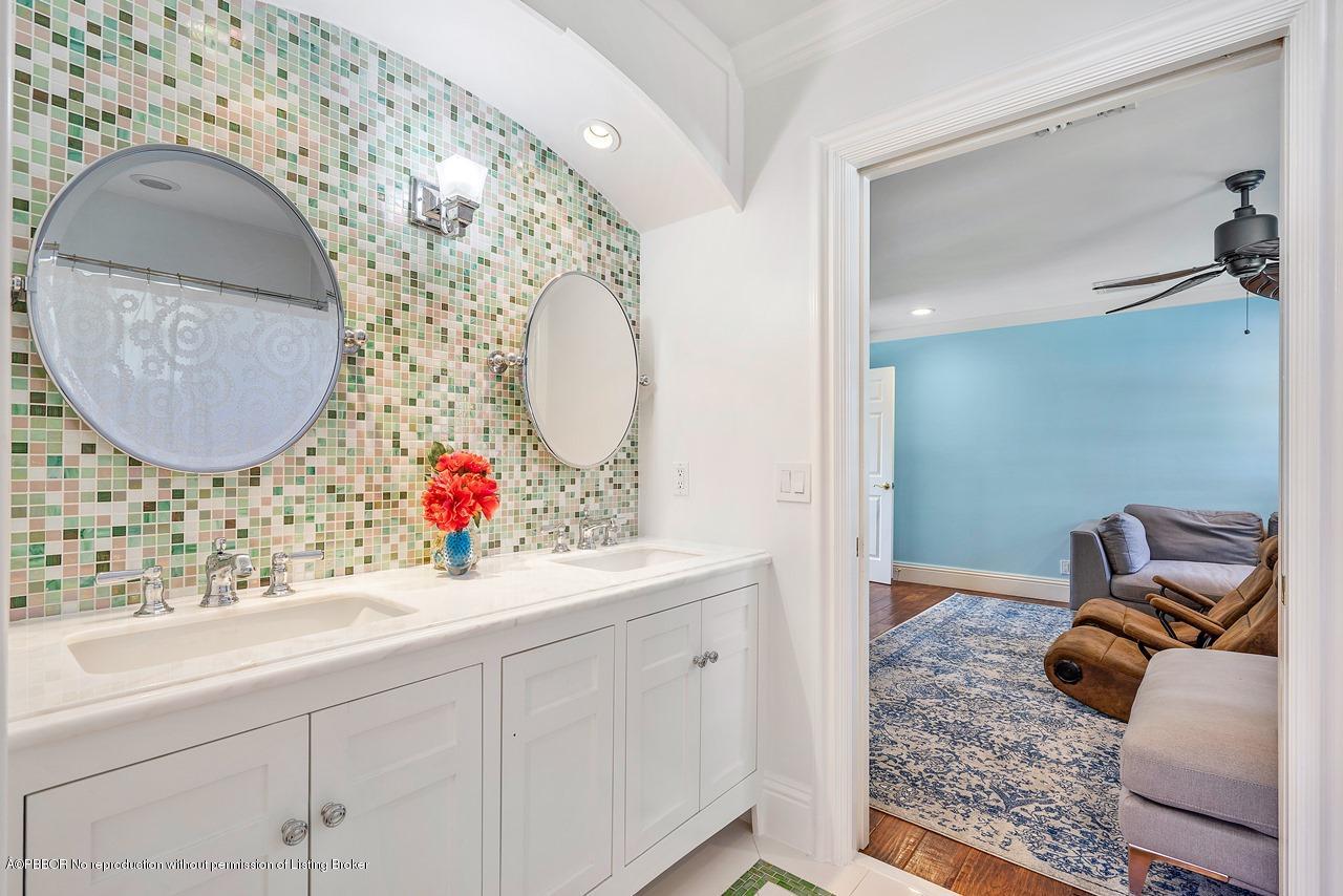 57 River Drive Ocean Ridge, FL 33435 - Photo 20 of 43 a bathroom with a sink and mirror