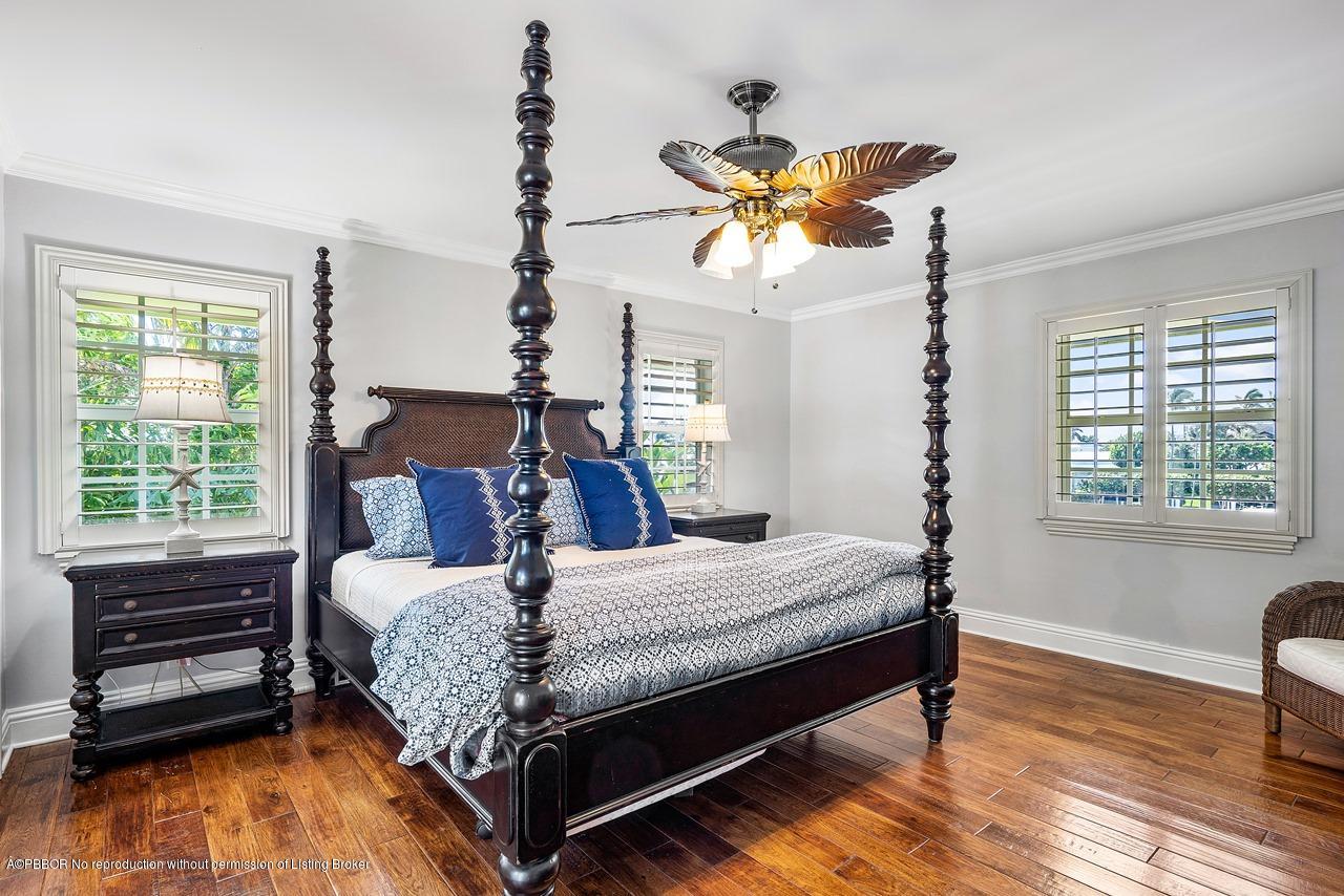 57 River Drive Ocean Ridge, FL 33435 - Photo 21 of 43 a bedroom with a bed dresser and a window
