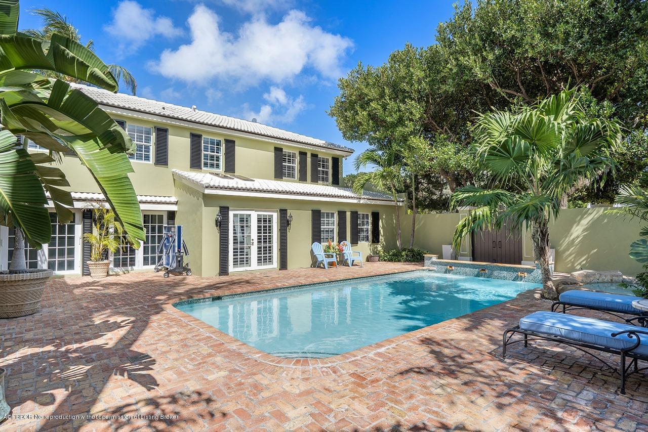 57 River Drive Ocean Ridge, FL 33435 - Photo 25 of 43 a front view of a house with a yard
