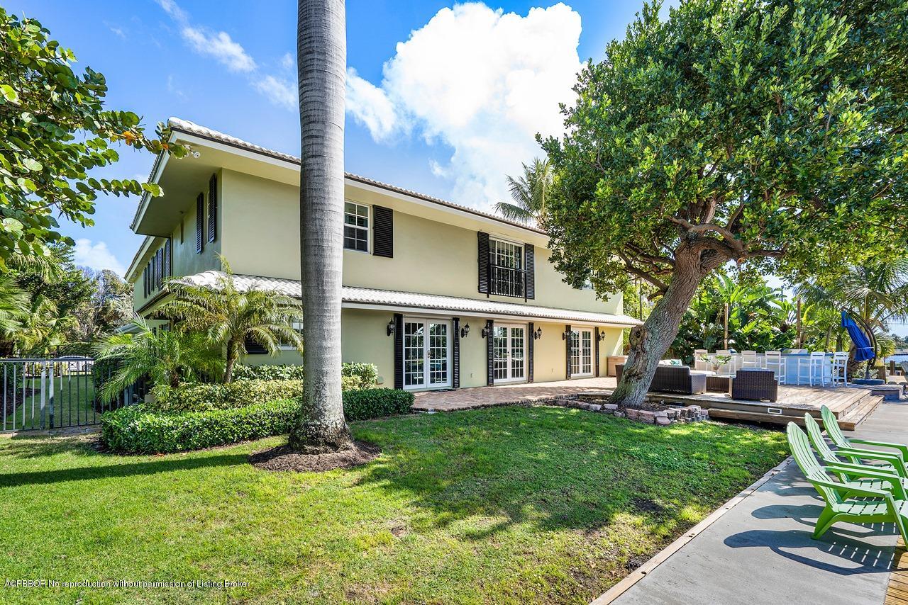 57 River Drive Ocean Ridge, FL 33435 - Photo 30 of 43 a view of a house with a backyard