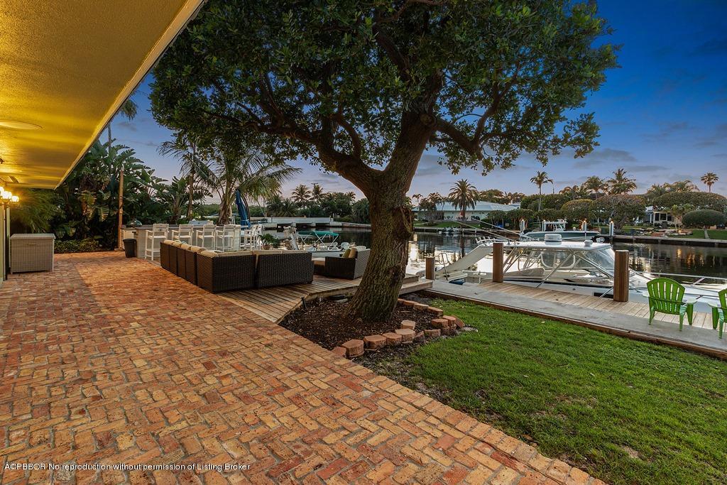 57 River Drive Ocean Ridge, FL 33435 - Photo 38 of 43 a view of a garden with sitting area