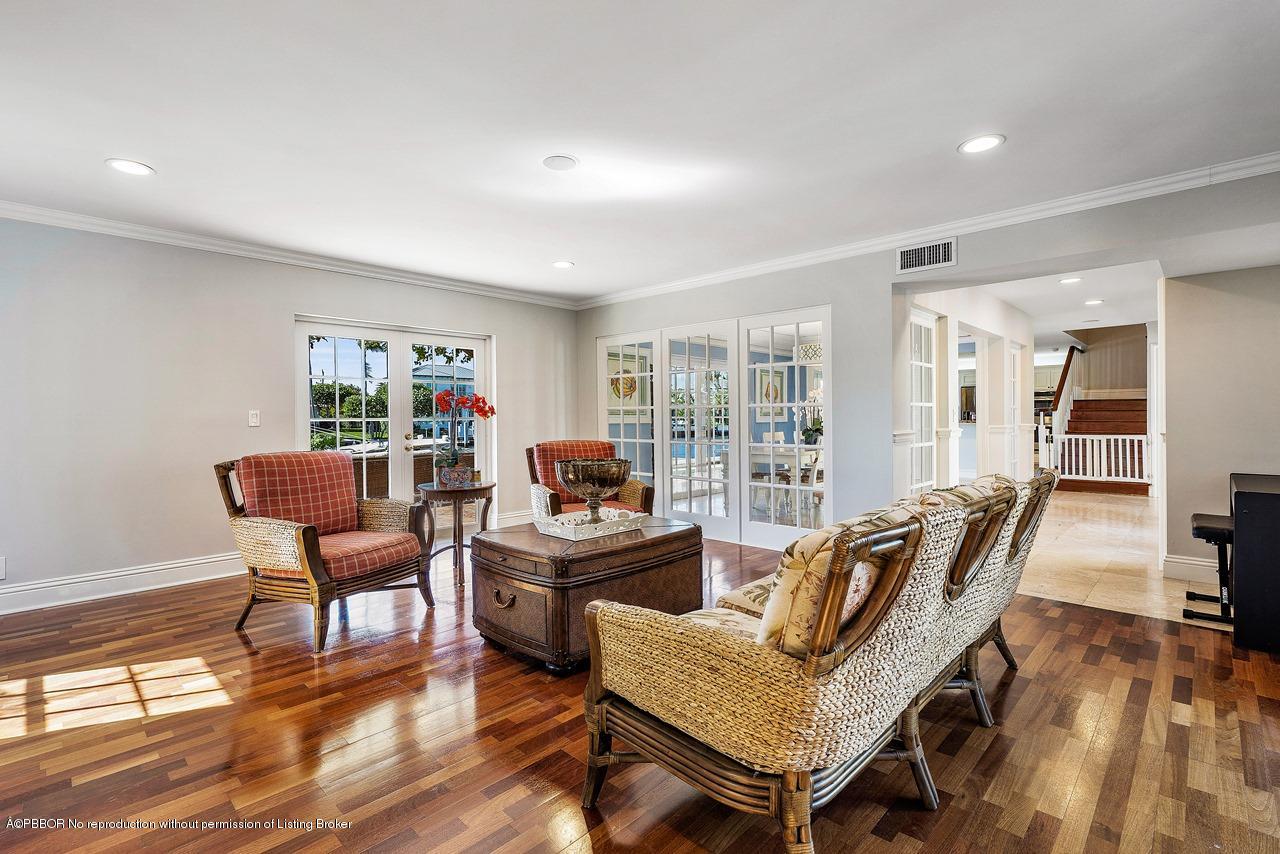 57 River Drive Ocean Ridge, FL 33435 - Photo 6 of 43 a living room with furniture a flat screen tv and a wooden floor