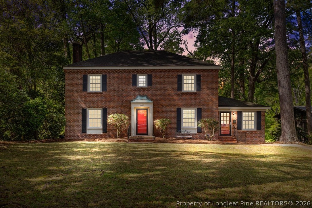 1007 Riverside Boulevard Lumberton, NC 28358 - Photo 1 of 42 a front view of house with yard and trees in the background