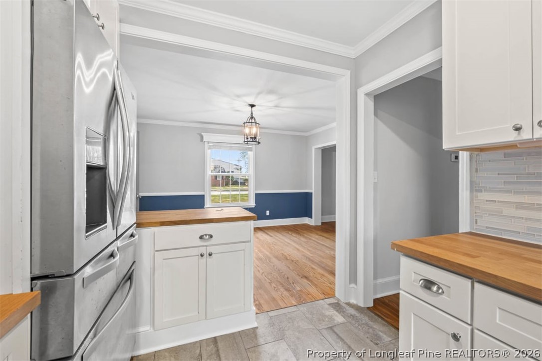 1007 Riverside Boulevard Lumberton, NC 28358 - Photo 13 of 42 a kitchen with granite countertop a sink cabinets and stainless steel appliances