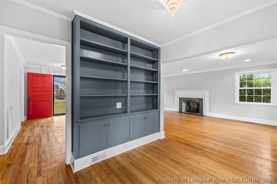 1007 Riverside Boulevard Lumberton, NC 28358 - Photo 17 of 42 a view of a livingroom with wooden floor and a fireplace