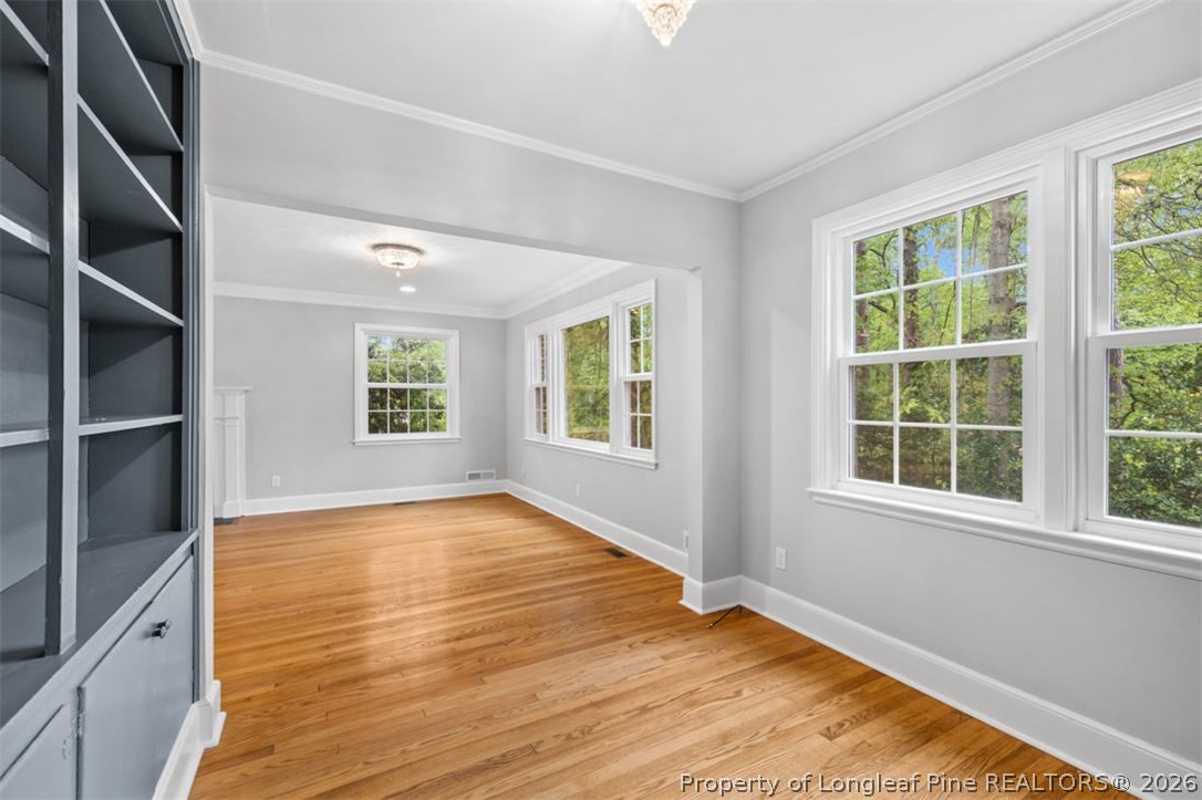 1007 Riverside Boulevard Lumberton, NC 28358 - Photo 18 of 42 an empty room with wooden floor and windows