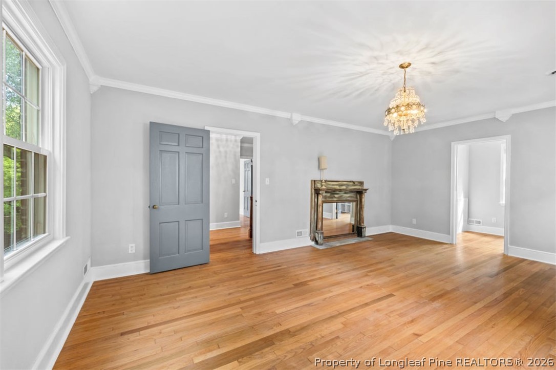 1007 Riverside Boulevard Lumberton, NC 28358 - Photo 23 of 42 a view of empty room with wooden floor and fan