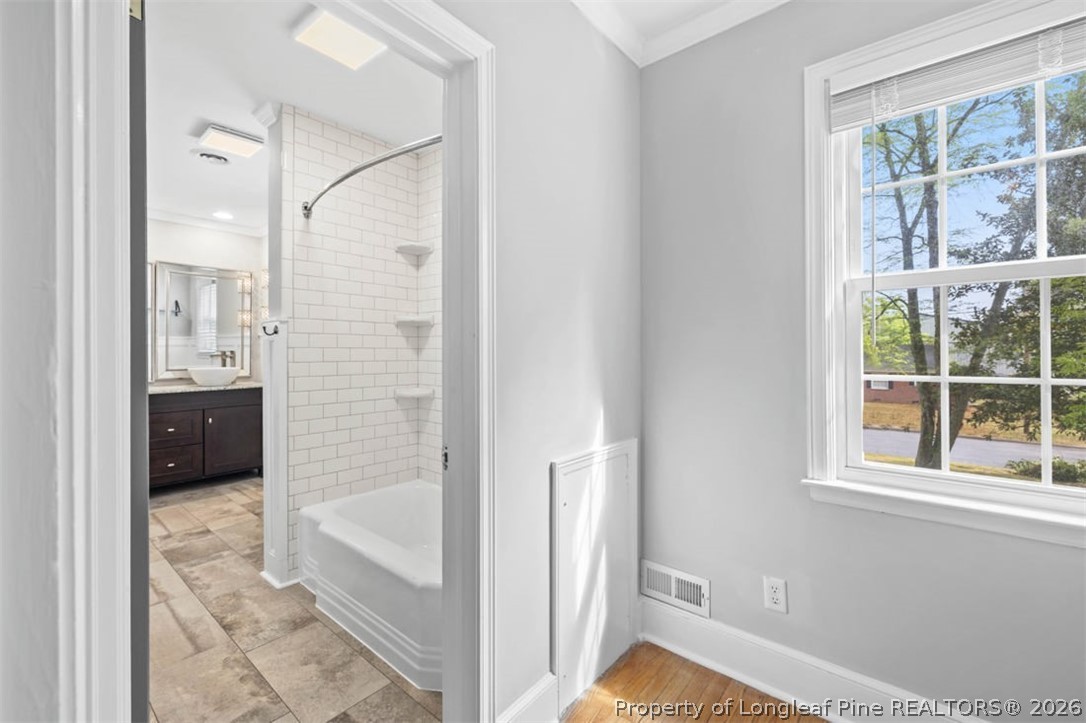 1007 Riverside Boulevard Lumberton, NC 28358 - Photo 25 of 42 a bathroom with a tub and shower