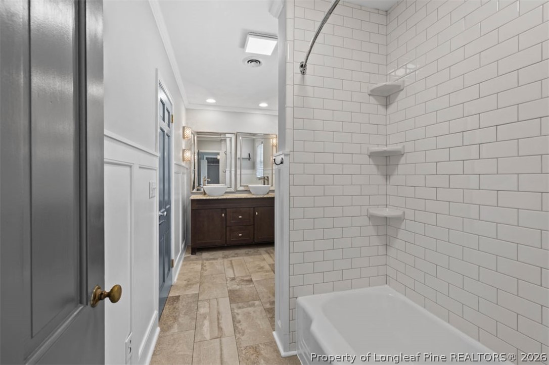 1007 Riverside Boulevard Lumberton, NC 28358 - Photo 26 of 42 a bathroom with a tub and a shower