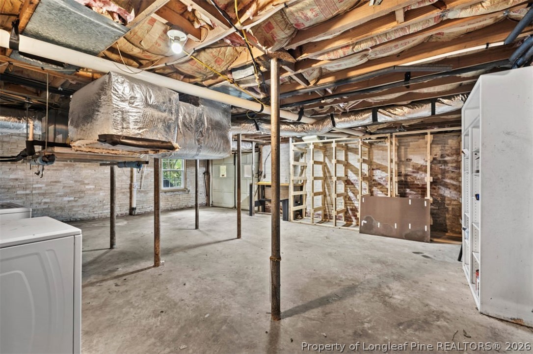 1007 Riverside Boulevard Lumberton, NC 28358 - Photo 32 of 42 a view of a garage with wooden table and chairs
