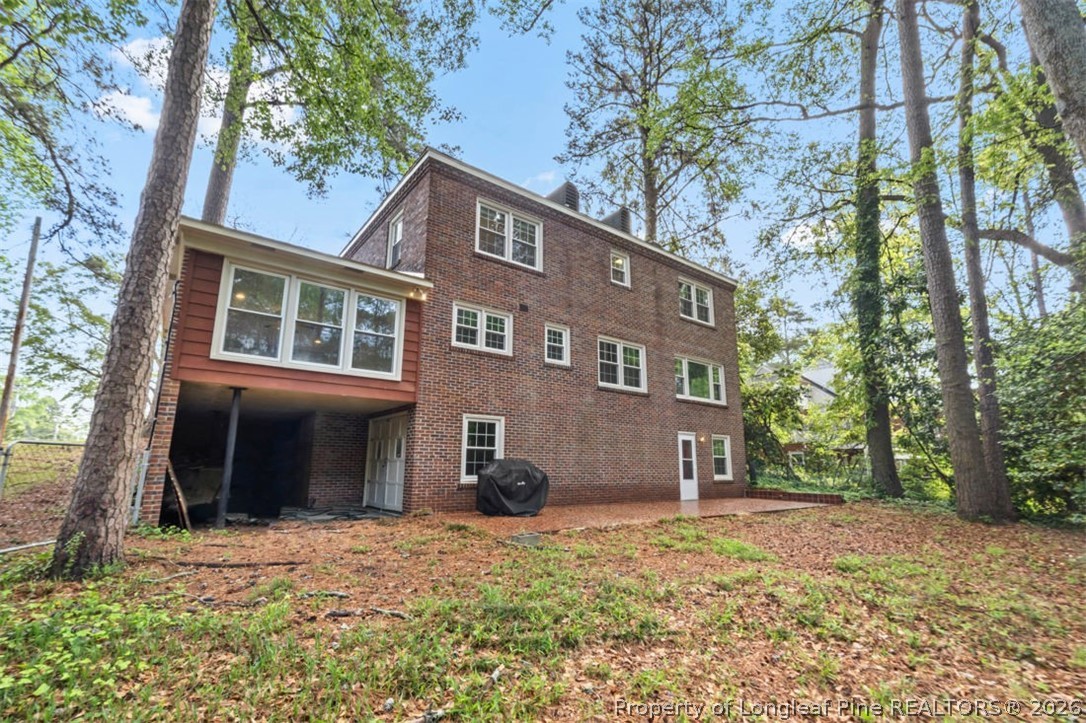 1007 Riverside Boulevard Lumberton, NC 28358 - Photo 35 of 42 a front view of a house with a yard and trees