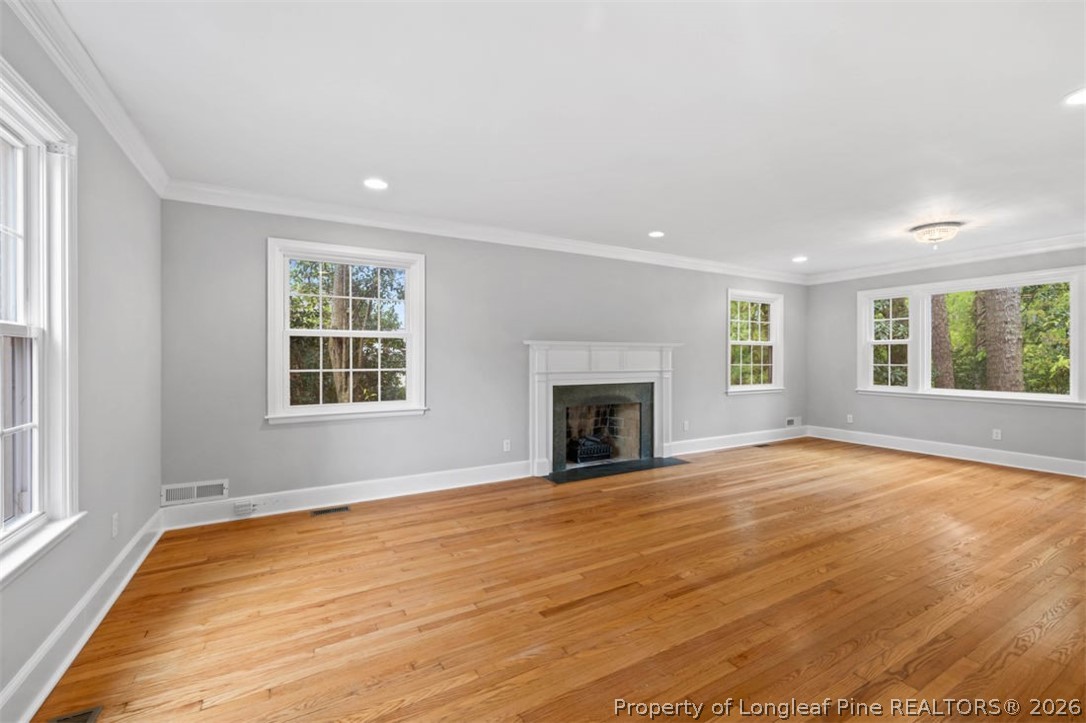 1007 Riverside Boulevard Lumberton, NC 28358 - Photo 5 of 42 a view of an empty room with wooden floor and a window