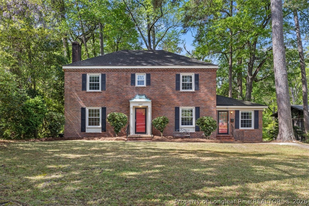 1007 Riverside Boulevard Lumberton, NC 28358 - Photo 6 of 42 a front view of a house with a yard