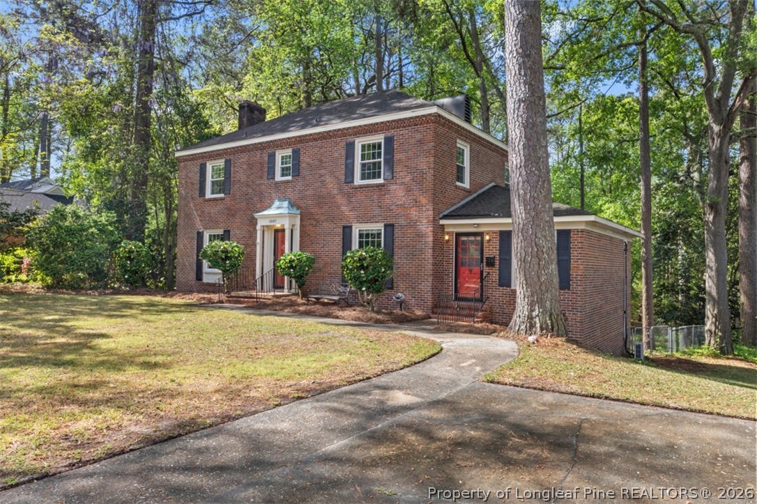 1007 Riverside Boulevard Lumberton, NC 28358 - Photo 7 of 42 a view of a house with backyard and trees