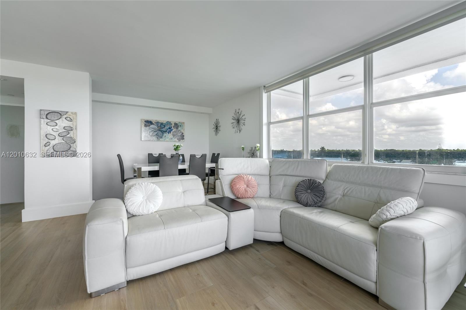 2639 North Riverside Drive, Unit 501 Pompano Beach, FL 33062 - Photo 12 of 39 a living room with furniture and a large window