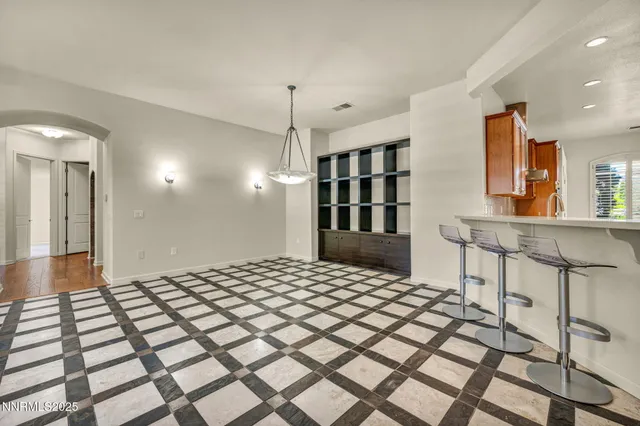 a kitchen with stainless steel appliances a stove sink and cabinets