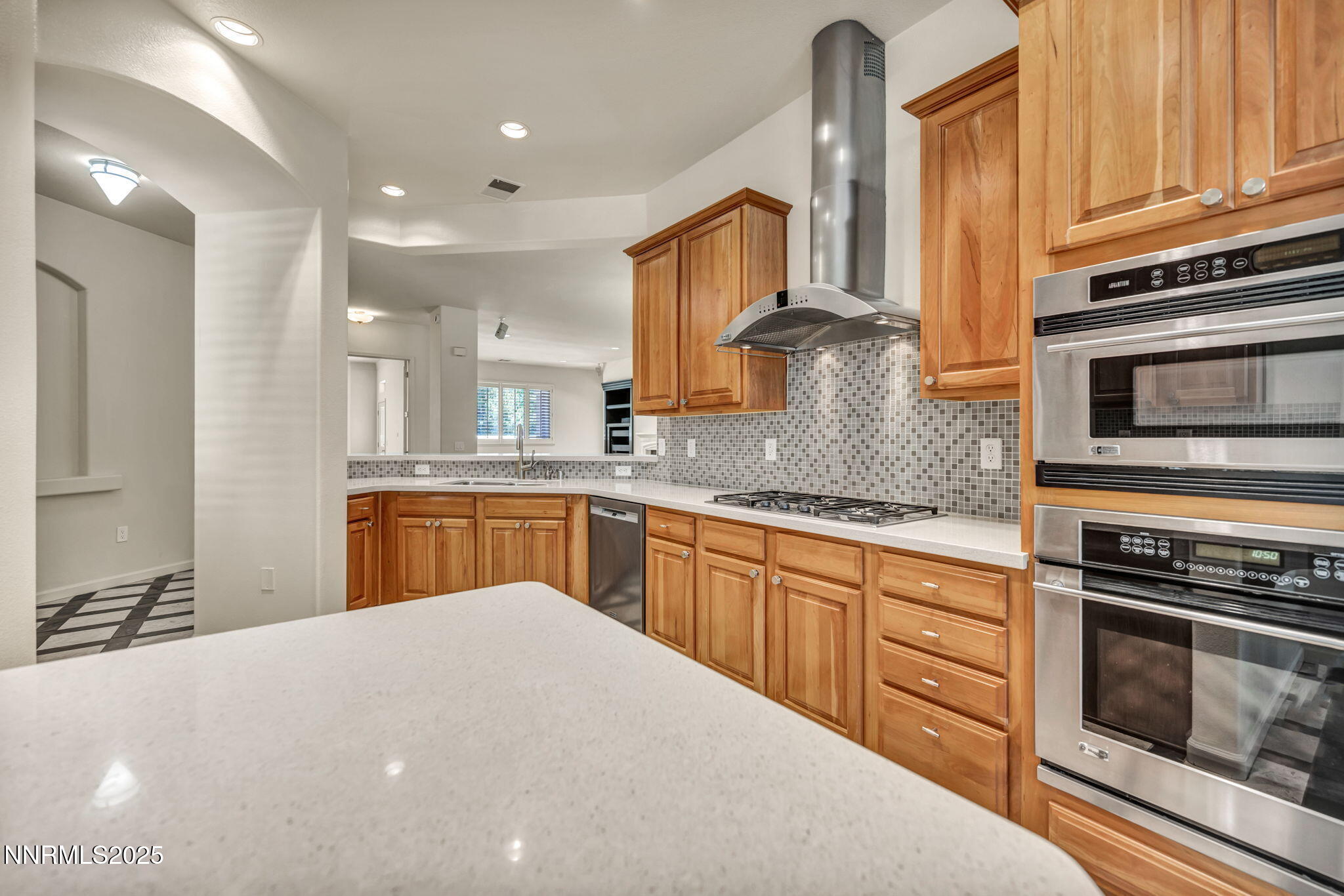 9900 Wilbur May Parkway, Unit 2801 Reno, NV 89521 - Photo 16 of 67 a kitchen with stainless steel appliances a stove sink and cabinets