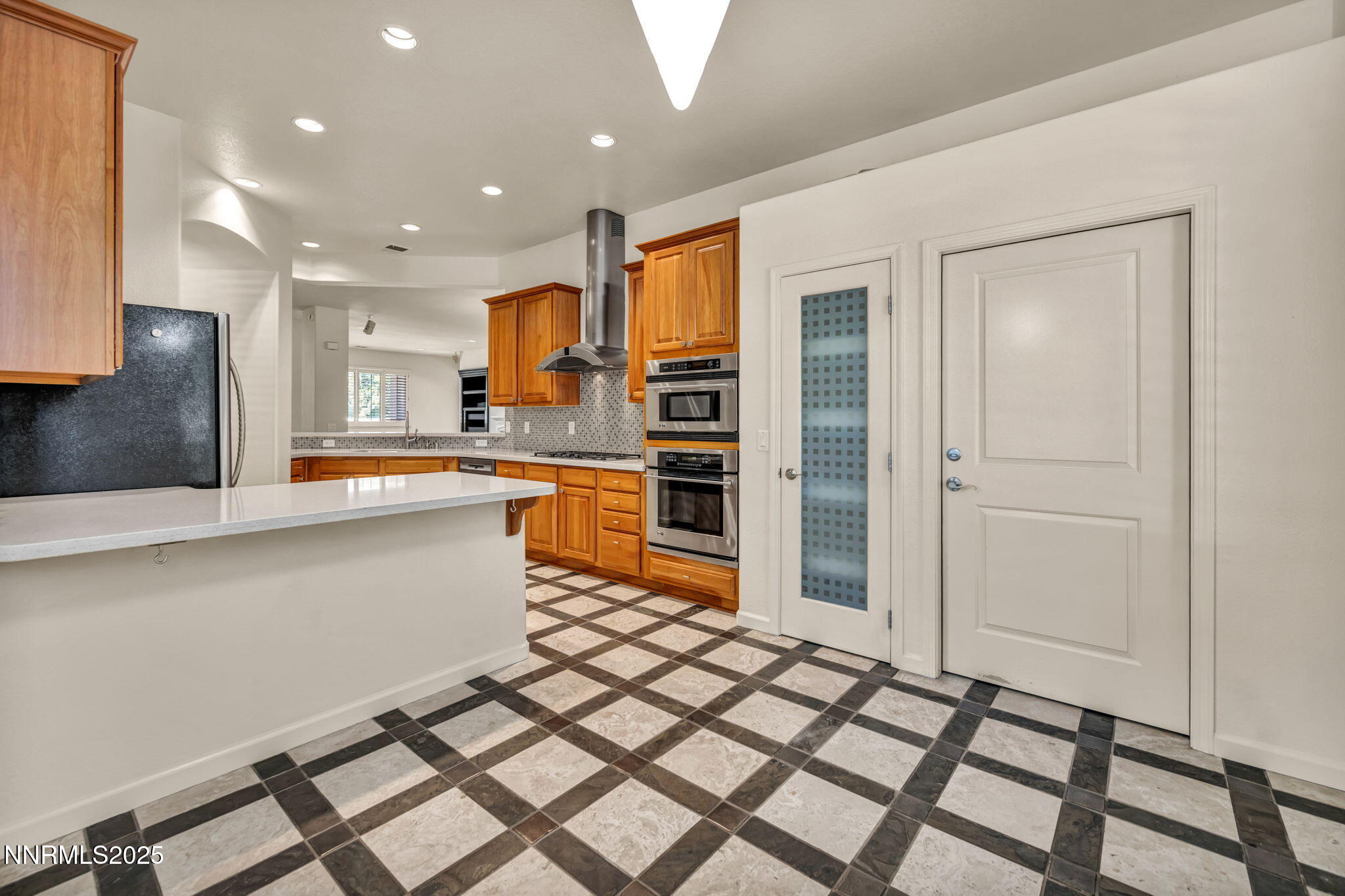 9900 Wilbur May Parkway, Unit 2801 Reno, NV 89521 - Photo 19 of 67 a kitchen with stainless steel appliances a refrigerator and a sink