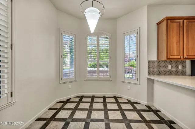 a kitchen with stainless steel appliances granite countertop a sink and a granite counter tops