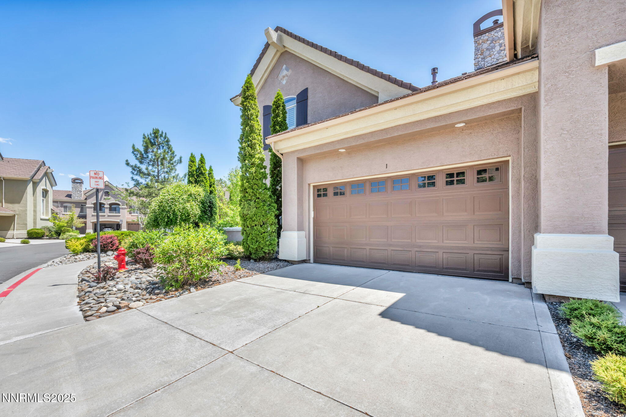 9900 Wilbur May Parkway, Unit 2801 Reno, NV 89521 - Photo 2 of 67 a front view of a house with a garage