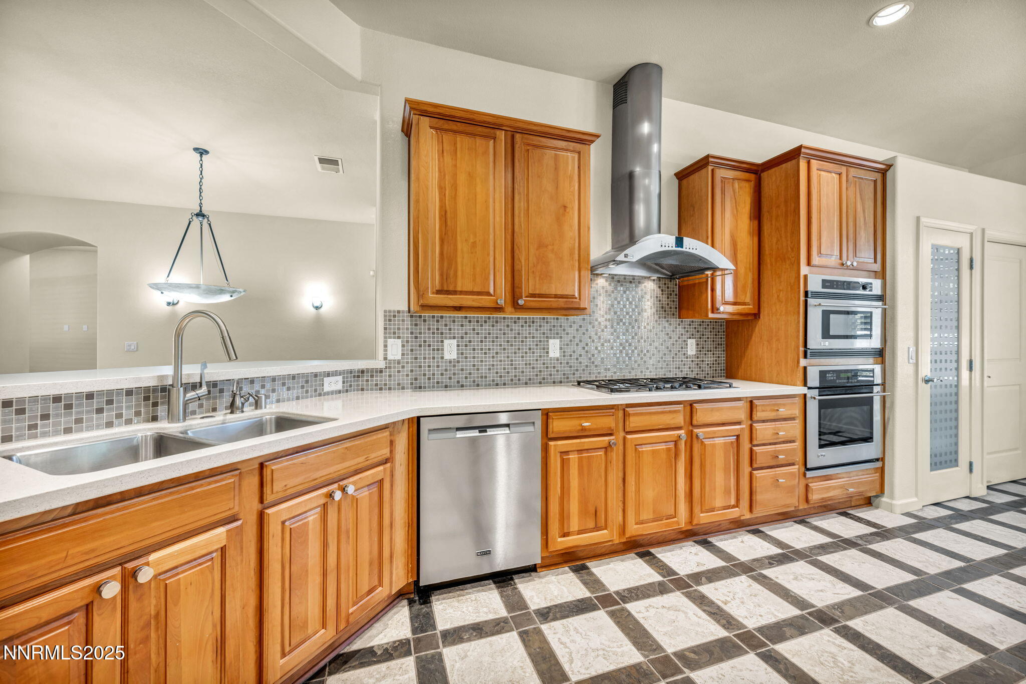 9900 Wilbur May Parkway, Unit 2801 Reno, NV 89521 - Photo 27 of 67 a kitchen with stainless steel appliances granite countertop a sink and a granite counter tops