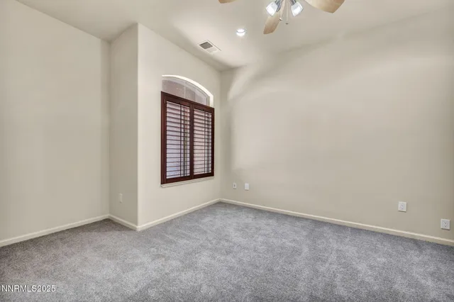 a view of a street with a building in the background