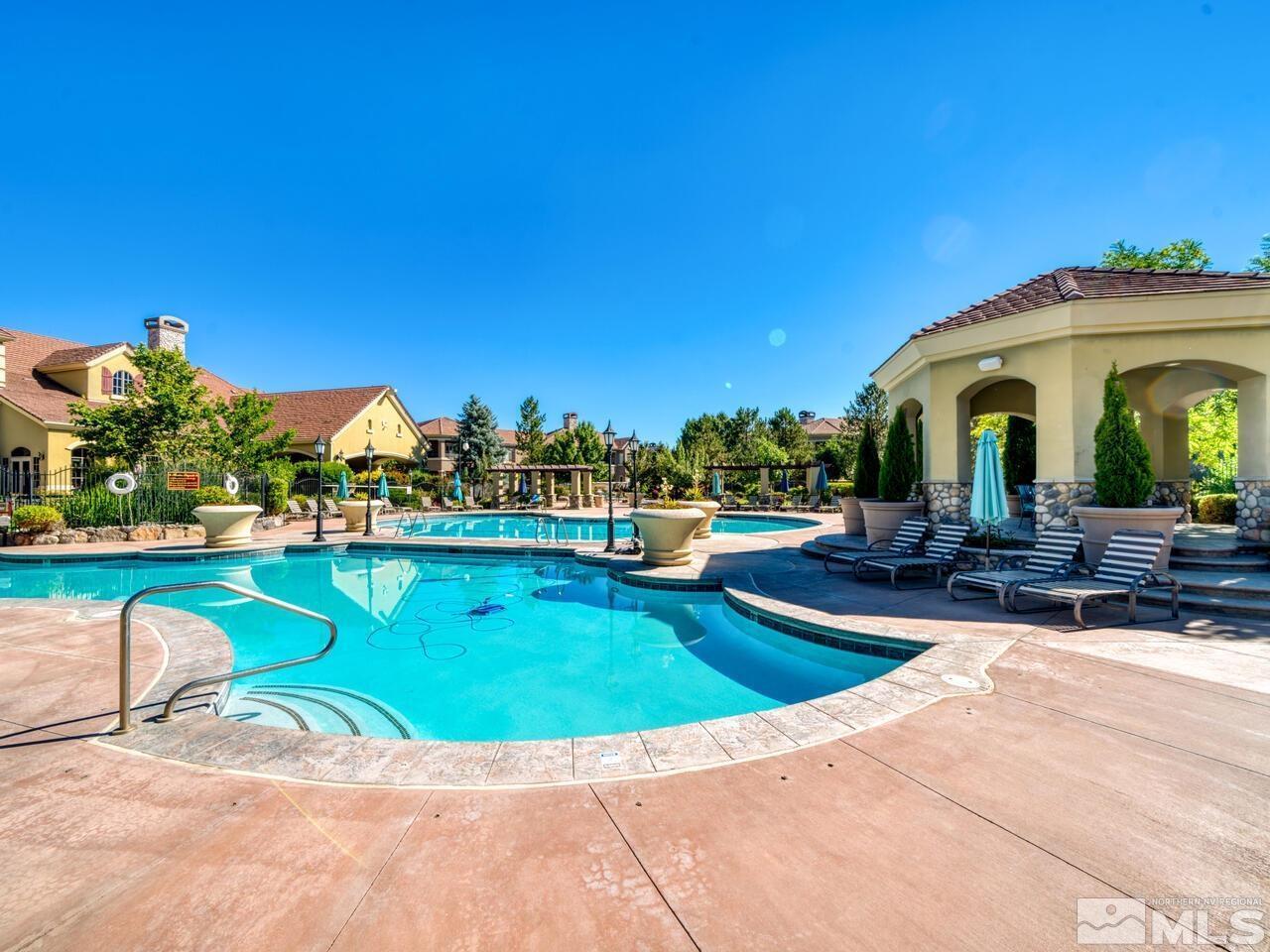 9900 Wilbur May Parkway, Unit 2801 Reno, NV 89521 - Photo 60 of 67 a view of a swimming pool with a patio