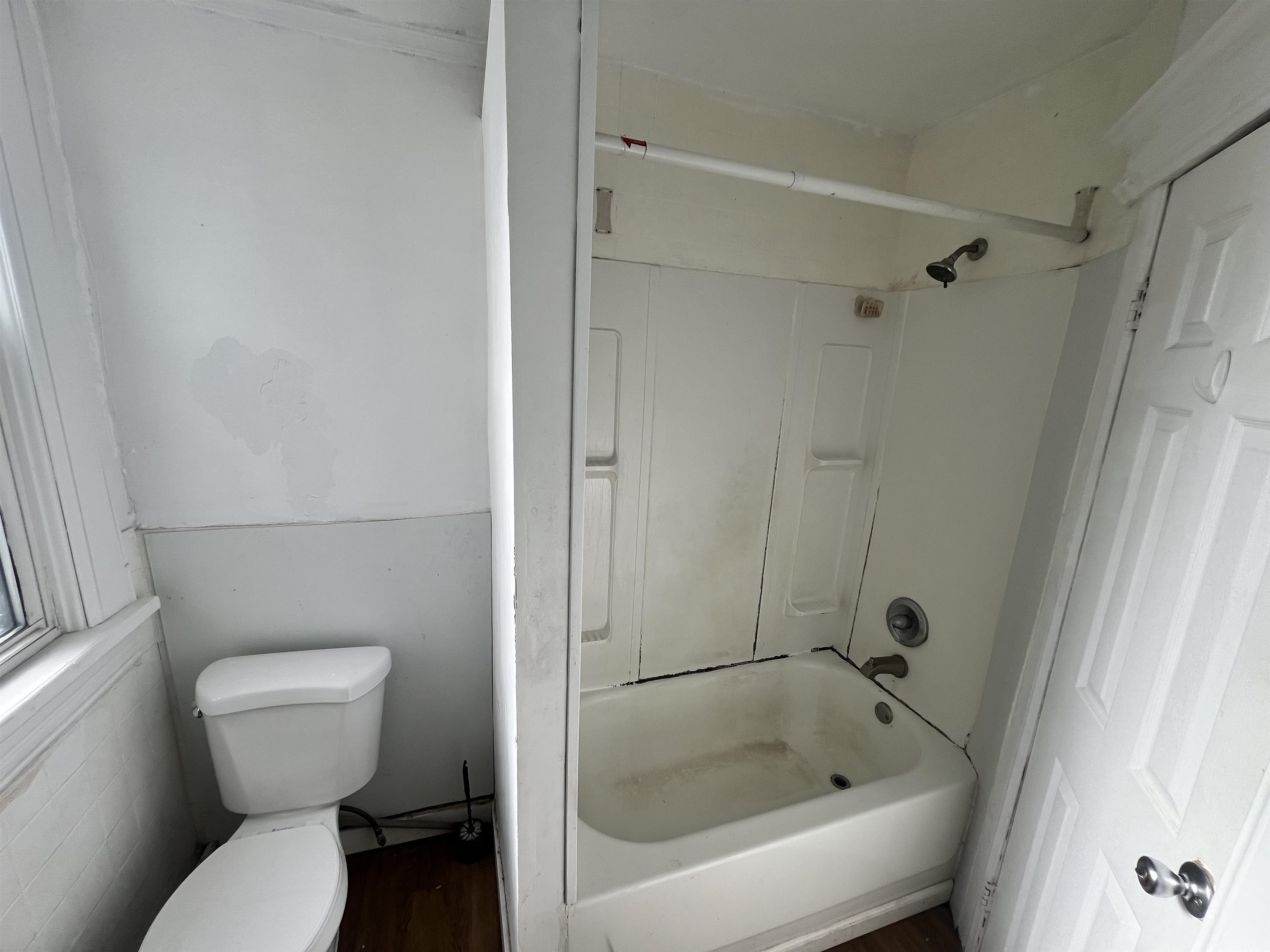 69 Clarke Avenue, Unit 2L Jersey City, NJ 07304 - Photo 4 of 8 a bathroom with a toilet and a shower