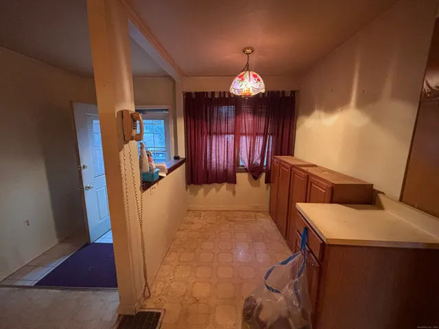 a view of living room with furniture and a chandelier